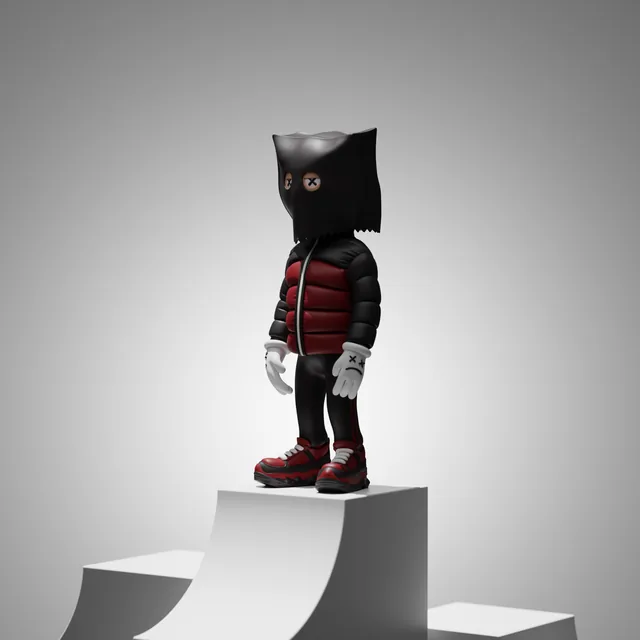The Designer Statue product image: a black bag-head figure on a white plinth